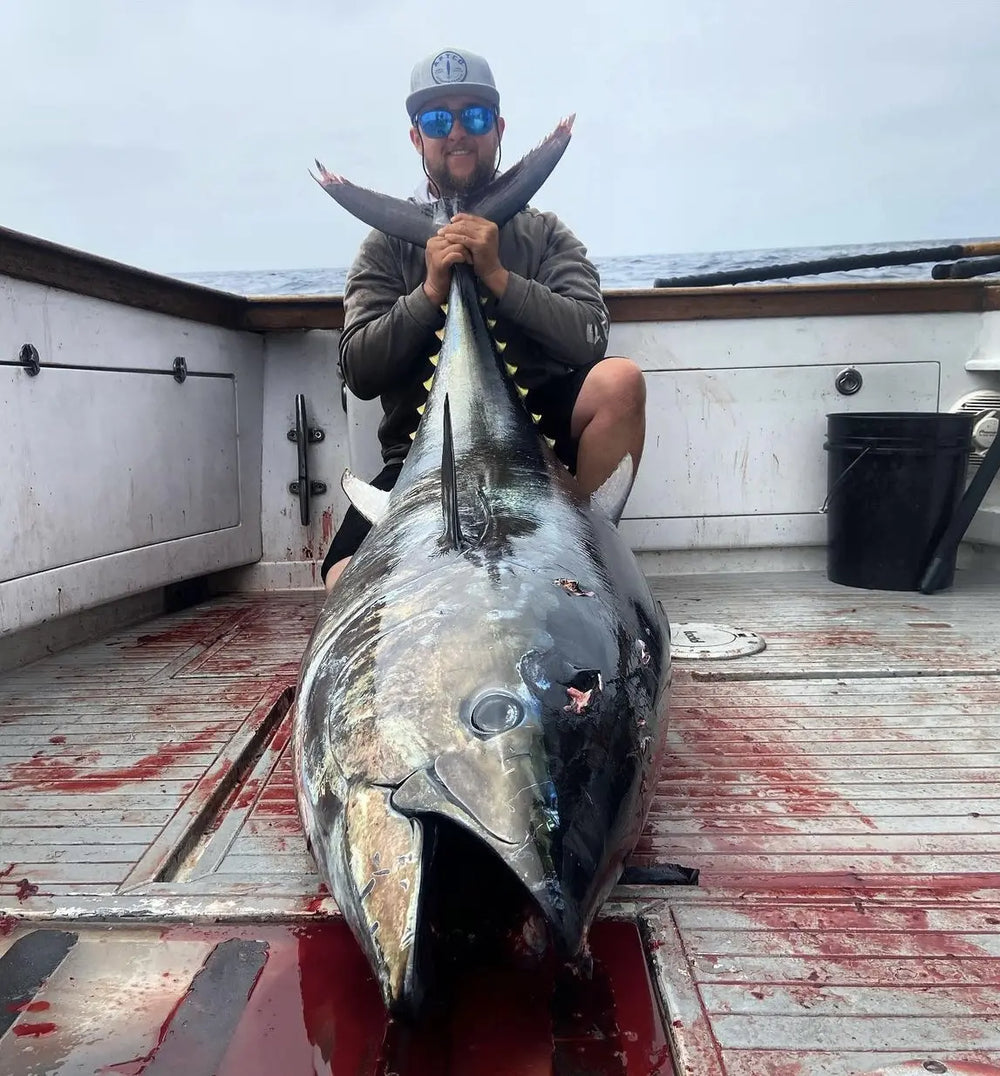 Angler with giant bluefin tuna caught using Opsin fluorocarbon