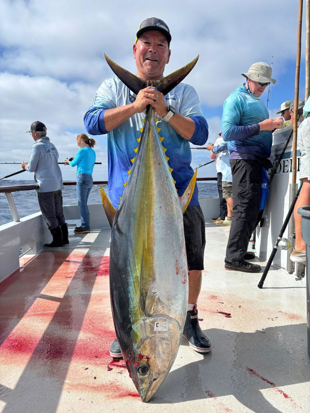 Ned Nakatsuka with a 104-pound tuna caught using Opsin leader